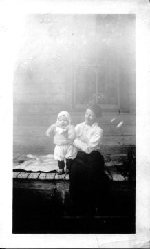 H004-Hilda Harper Benton as a young married preacher holding Ray, her first child.
